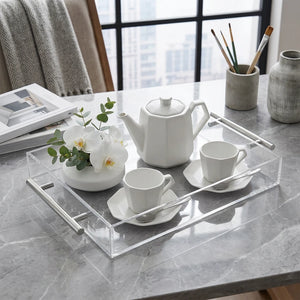 Clear acrylic storage tray with two silver metal handles, shown on a plain white background.