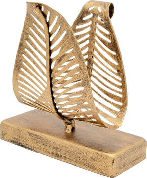 Decorative gold leaf sculpture on a white background