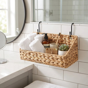 A woven natural fiber hanging basket shown from two angles, labeled Front and Back, with black metal hooks attached to the sides. The basket is made of a light tan seagrass or straw material and is photographed on a plain white background.