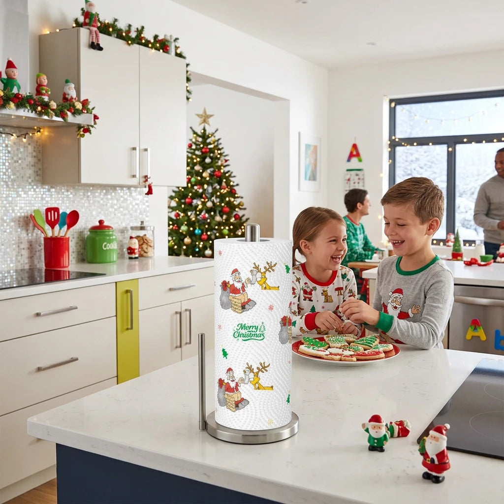 A roll of paper towels with a festive Christmas pattern featuring Santa Claus, reindeer, snowflakes, and the text 'Merry Christmas' on a white background.