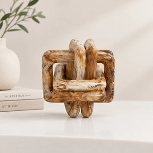 A rustic wooden knot puzzle with a weathered, natural brown finish, isolated on a white background.