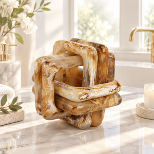 Marble-like cube with interlocking design on a white background